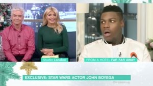 John Boyega Shocked When a TV Host Drops a Huge Spoiler For THE LAST JEDI on Live TV
